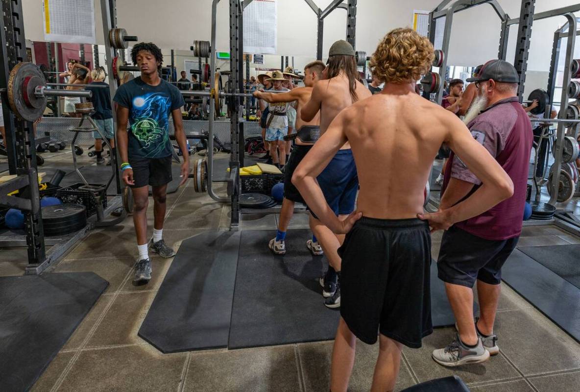 John Clausen/Pahrump Valley Times Head coach Thom Walker (right) giving his players advice duri ...