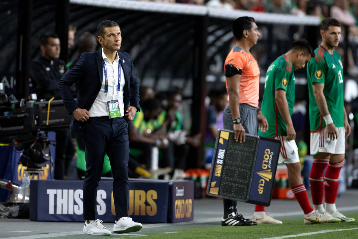 Mexico manager Jaime Lozano, left, paces the sidelines during the second half of a CONCACAF Gol ...