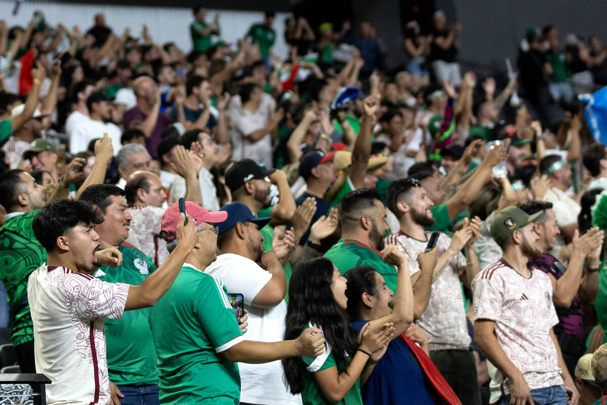 Mexico celebrate after their team scored on Jamaica during the first half of a CONCACAF Gold Cu ...