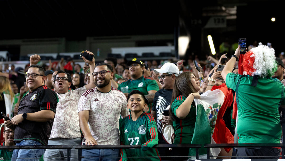 Mexico celebrate after their team scored on Jamaica during the first half of a CONCACAF Gold Cu ...