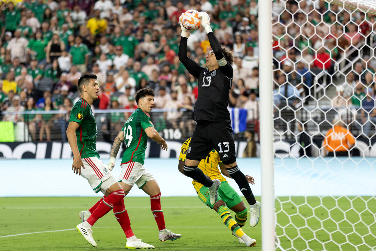 Mexico goalkeeper Guillermo Ochoa (13) saves the ball against Jamaica during the first half of ...
