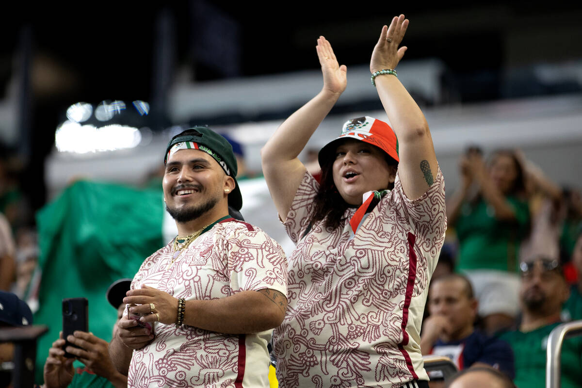 Mexico fans clap for their team as they take the field during the first half of a CONCACAF Gold ...