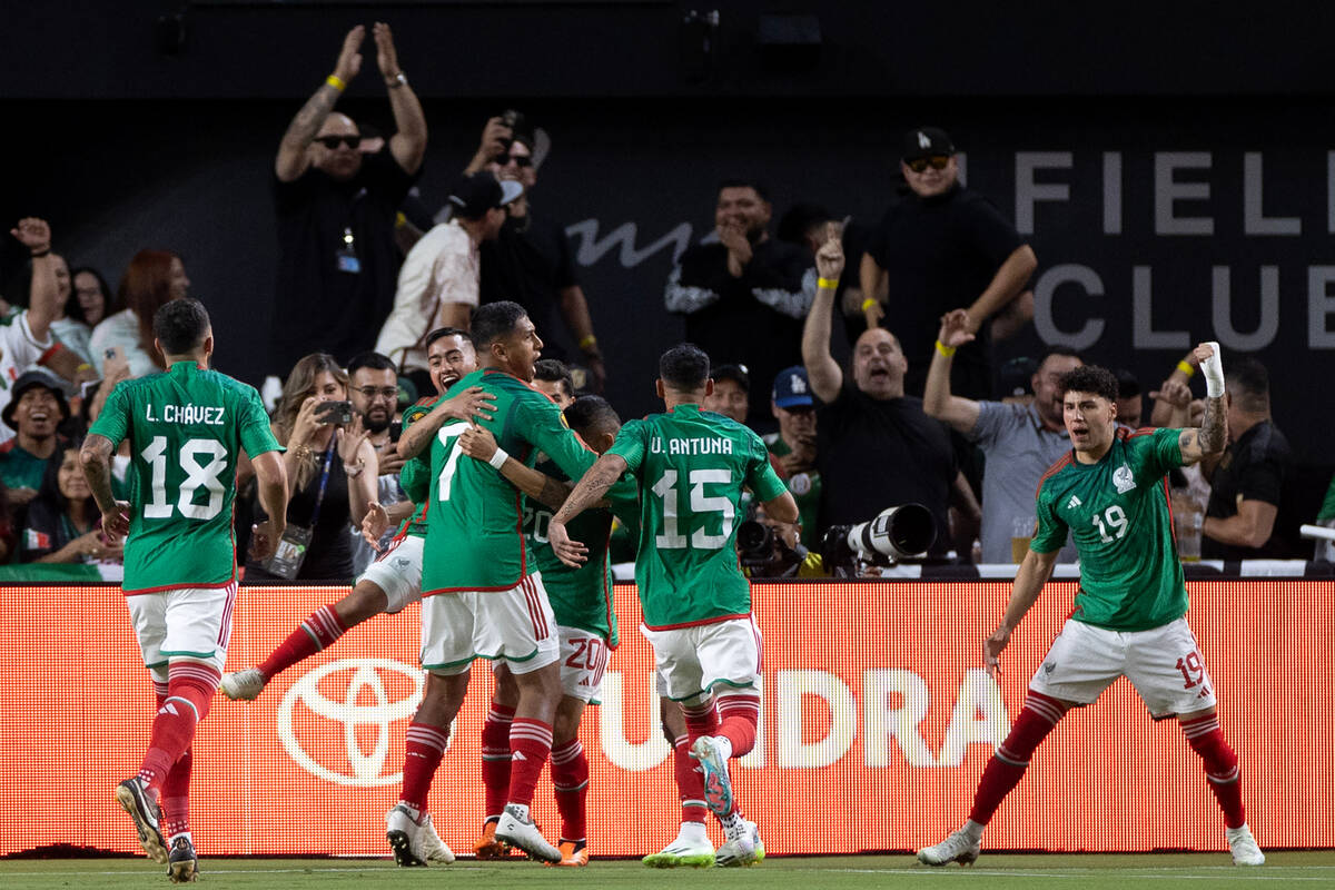 Mexico celebrates after they scored on Jamaica during the first half of a CONCACAF Gold Cup sem ...