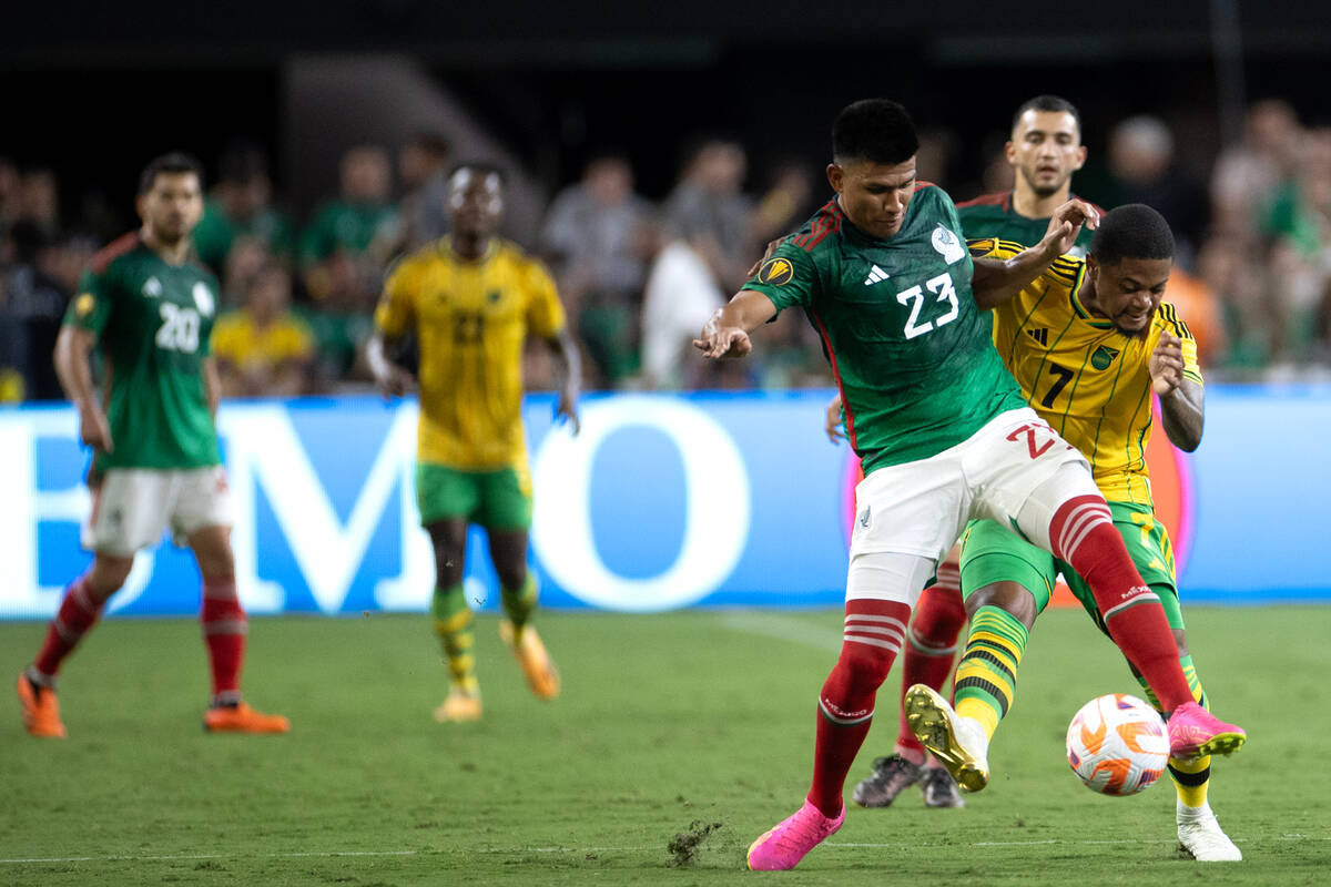 Mexico defender Jesús Gallardo (23) dribbles against Jamaica forward Leon Bailey (7) durin ...