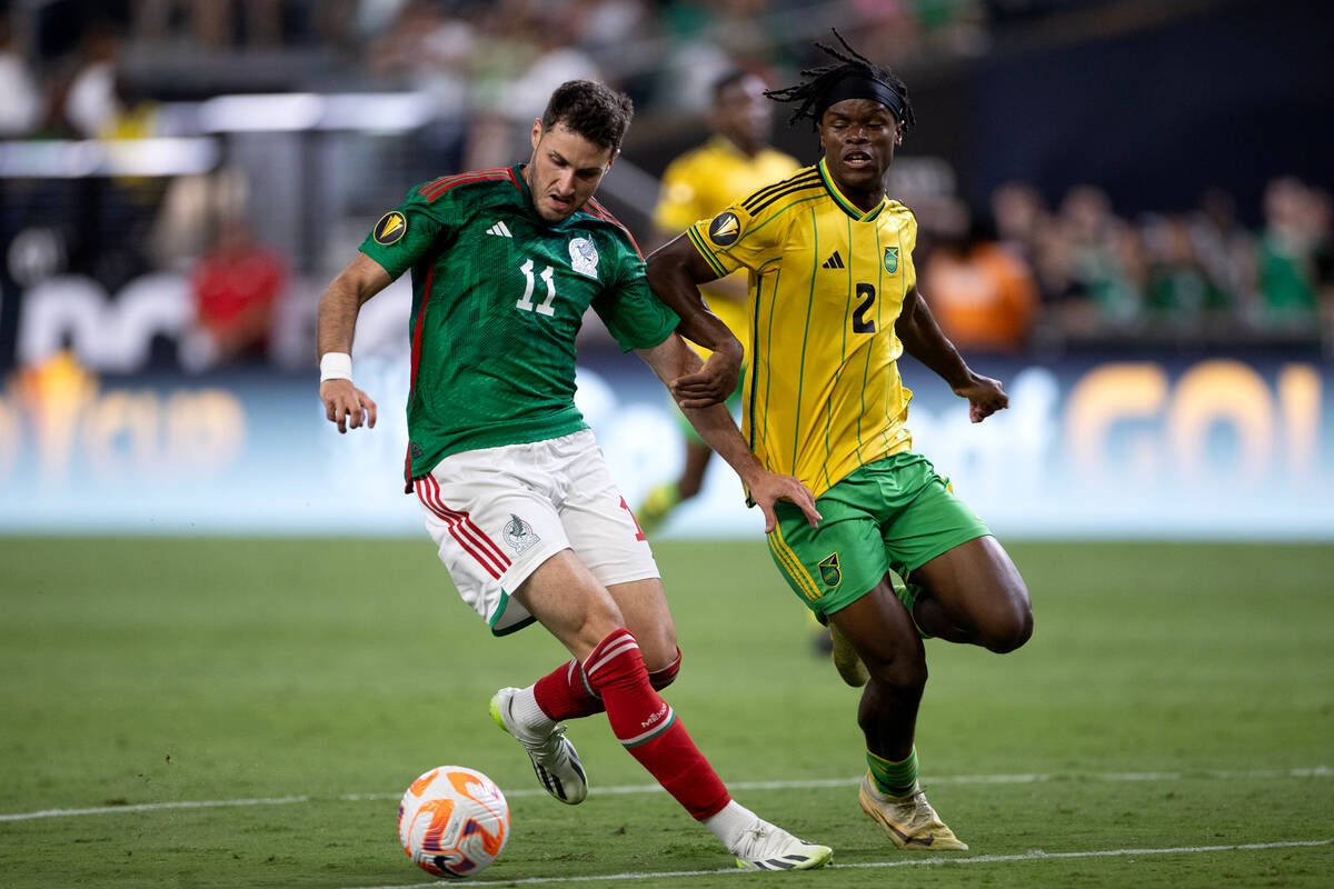 Mexico forward Santiago Giménez (11) dribbles for the net against Jamaica defender Dexter ...