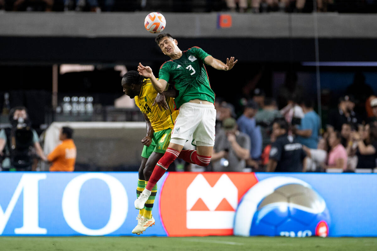 Mexico defender César Montes (3) makes a header against Jamaica forward Michail Antonio (1 ...