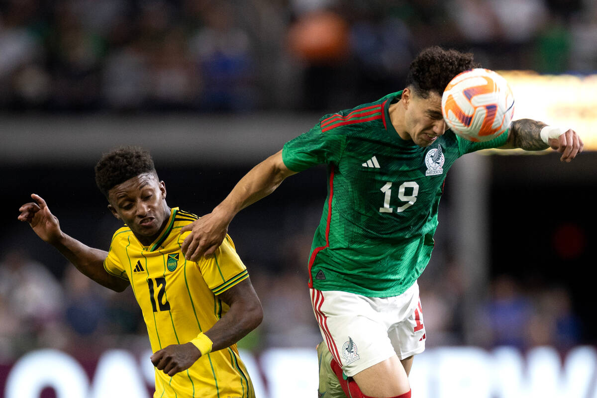 Mexico defender Jorge Sánchez (19) heads the ball against Jamaica forward Demarai Gray (12 ...
