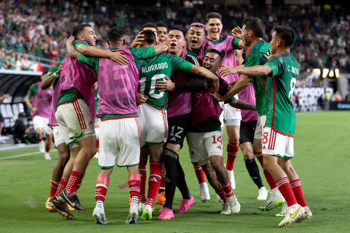 Mexico celebrates after winning a CONCACAF Gold Cup semifinal soccer match against Jamaica at A ...