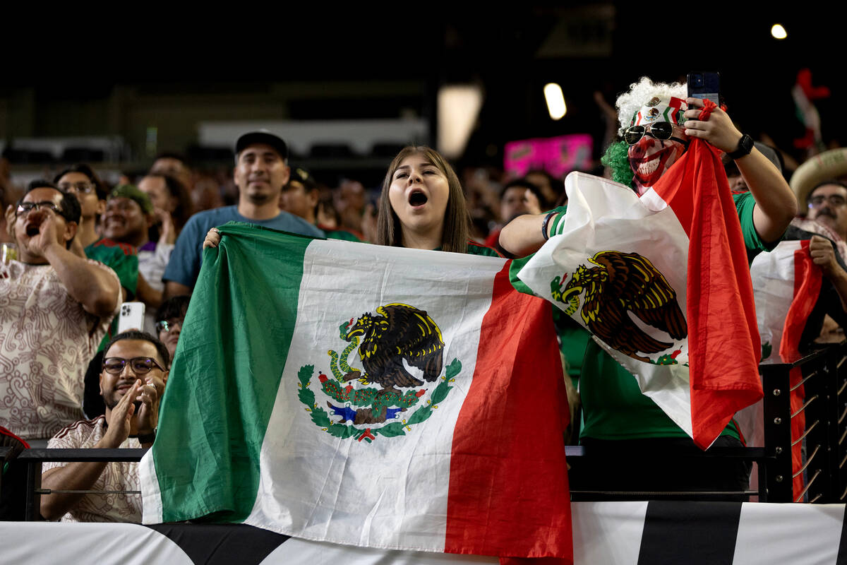 Mexico fans cheer after their team won of a CONCACAF Gold Cup semifinal soccer match against Ja ...