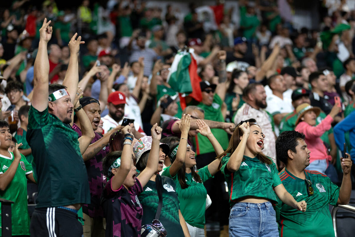 Mexico cheer after their team scored in the first two minutes during the first half of a CONCAC ...