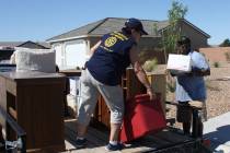 Robin Hebrock/Pahrump Valley Times file Members of the Pahrump Valley Rotary Club help with a m ...