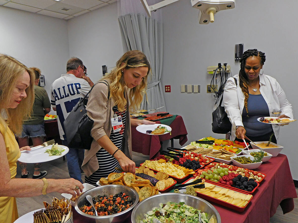 Robin Hebrock/Pahrump Valley Times OptimuM Urgent Care Open House attendees are pictured enjoyi ...