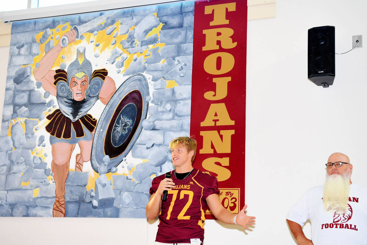 Peter Davis/Pahrump Valley Times Former Trojan team captain Tannor Hanks, left, and current he ...
