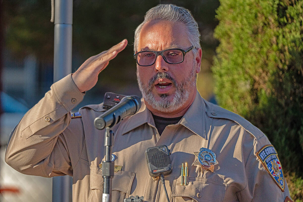 John Clausen/Pahrump Valley Times Nye County Sheriff's Deputy Greg Curtain sings the National A ...