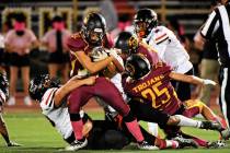 Peter Davis/Pahrump Valley Times Junior running back Austin Sandoval carries the ball in the T ...
