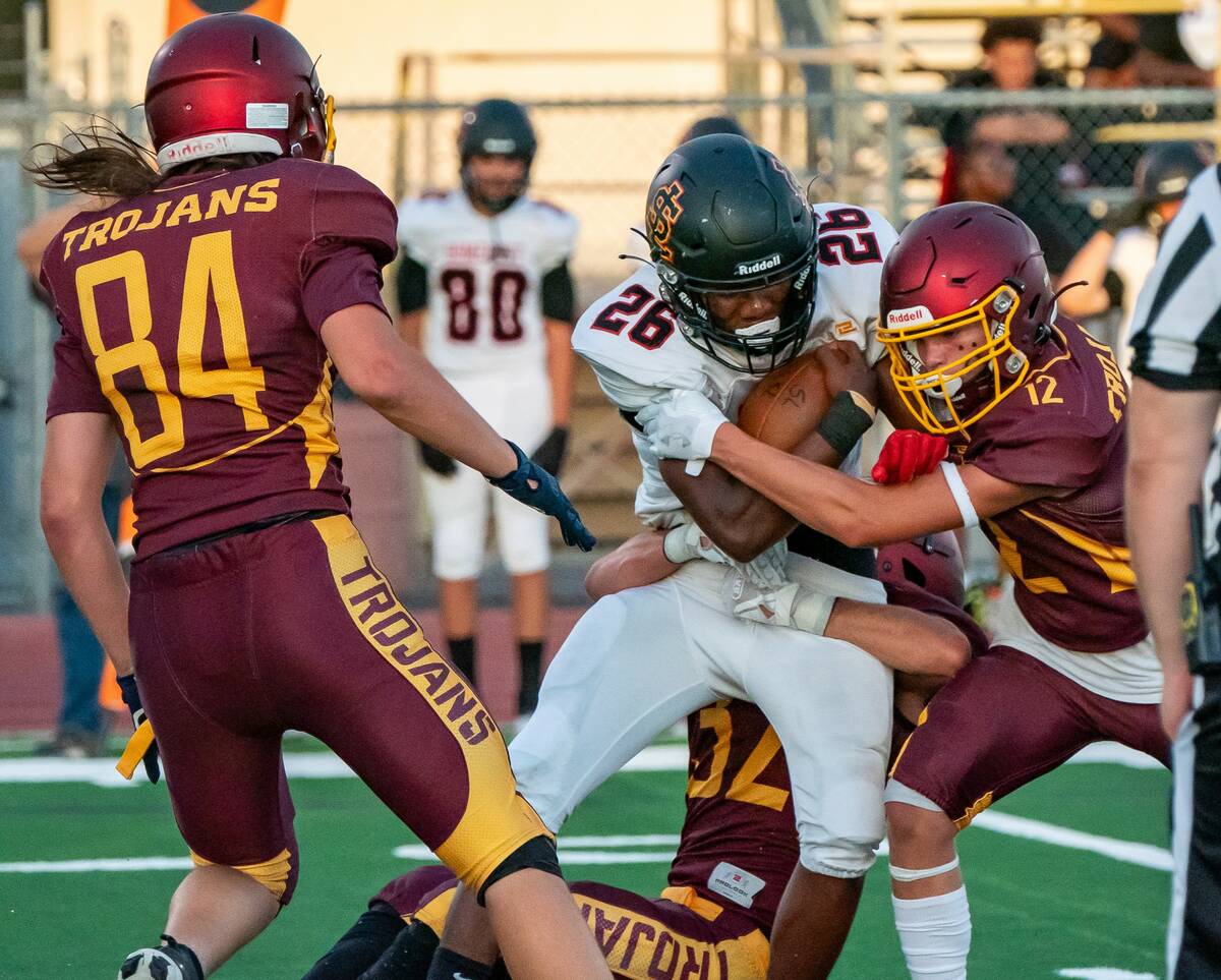 John Clausen/Pahrump Valley Times Austin Sandoval (32) and Kayne Horibe (12) combine for the ta ...