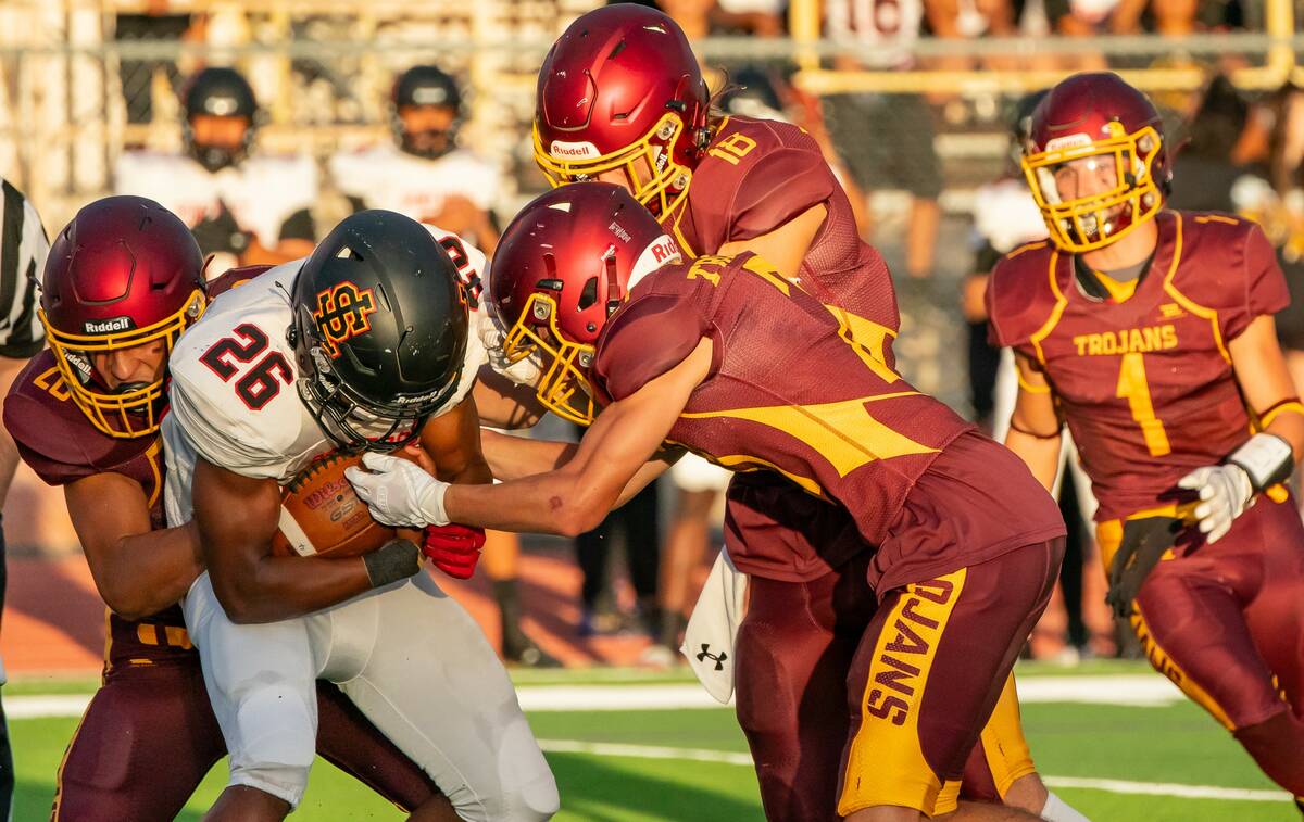 John Clausen/Pahrump Valley Times The Pahrump Valley defense tackles the Losee Lions' running b ...