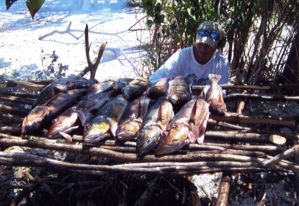 Special to the Times-Bonanza A traditional fish feast sizzles on the grill. Communities would s ...