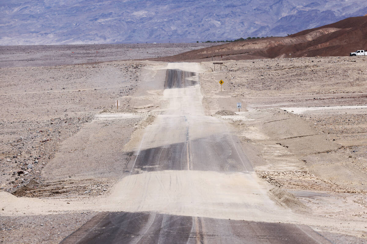Dirt from Hilary covers parts of Badwater Road in Death Valley National Park in California on T ...