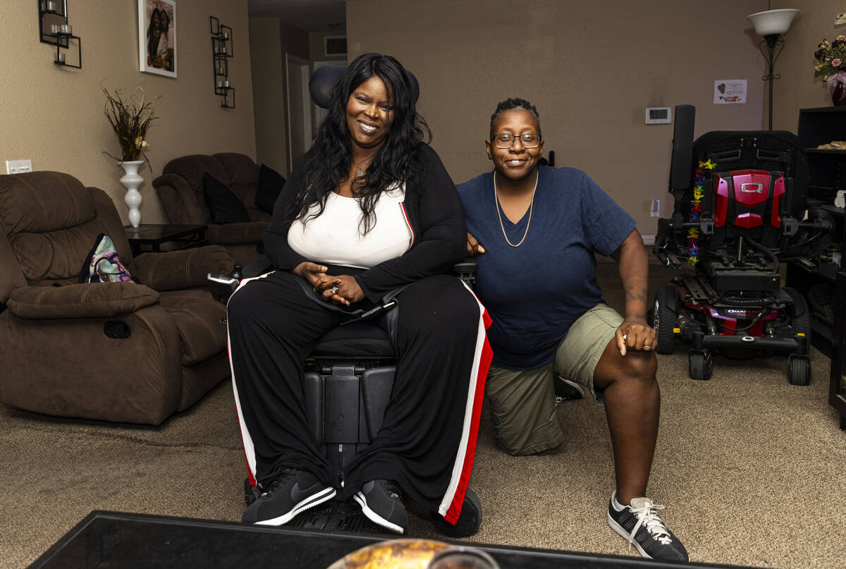 Nicole Brown, a home care worker with Consumer Direct Care Network, right, poses with her clien ...