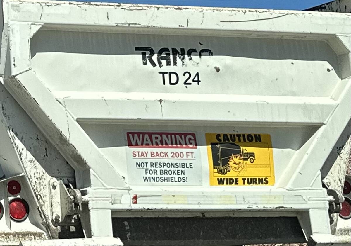 A warning sign is posted on the back of dump truck seen on Interstate 11 in Henderson on Tuesda ...