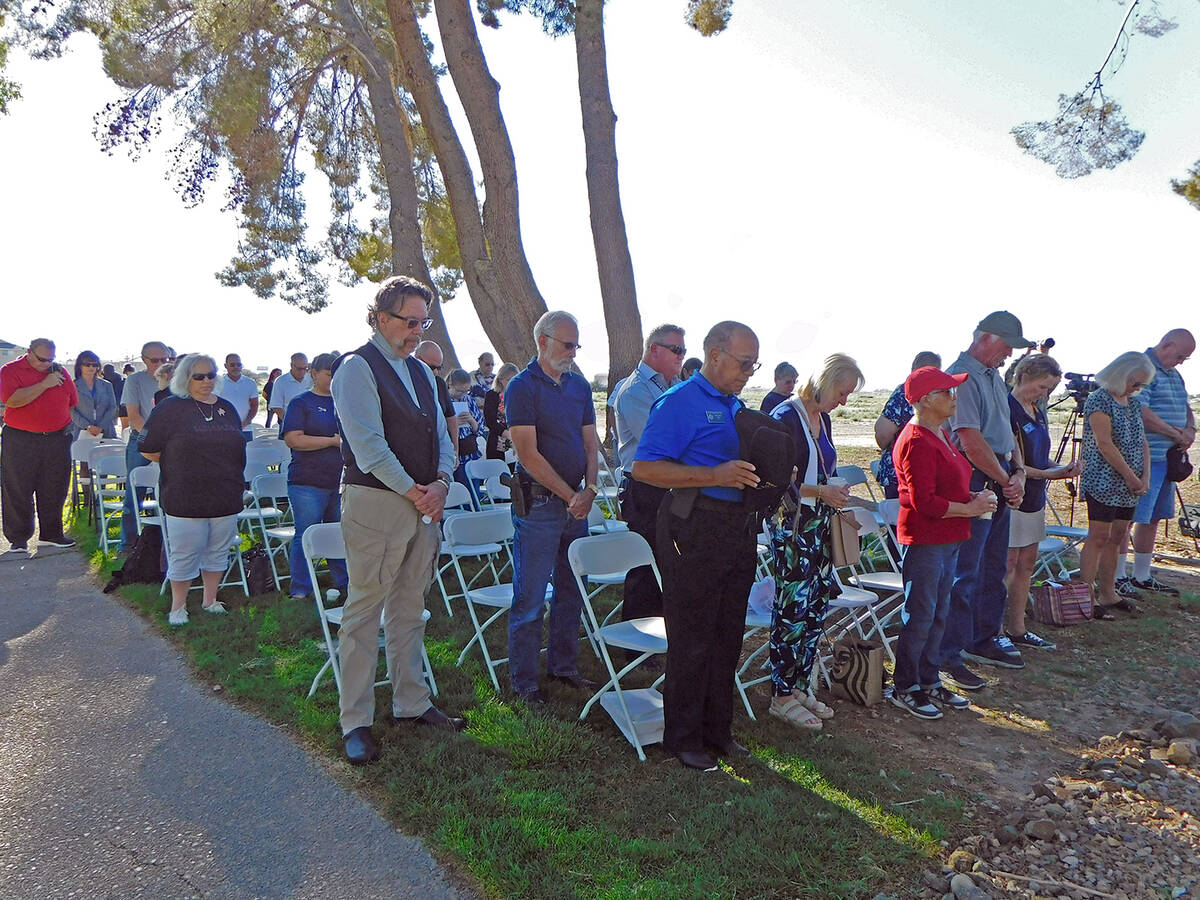 Robin Hebrock/Pahrump Valley Times With heads bowed in prayer, attendees of the 9/11 Memorial C ...