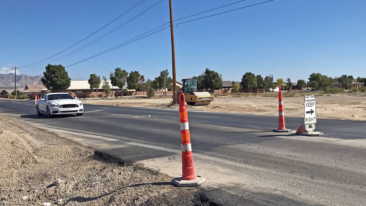 Robin Hebrock/Pahrump Valley Times Orange cones and a keep-right sign can be seen on Basin Aven ...