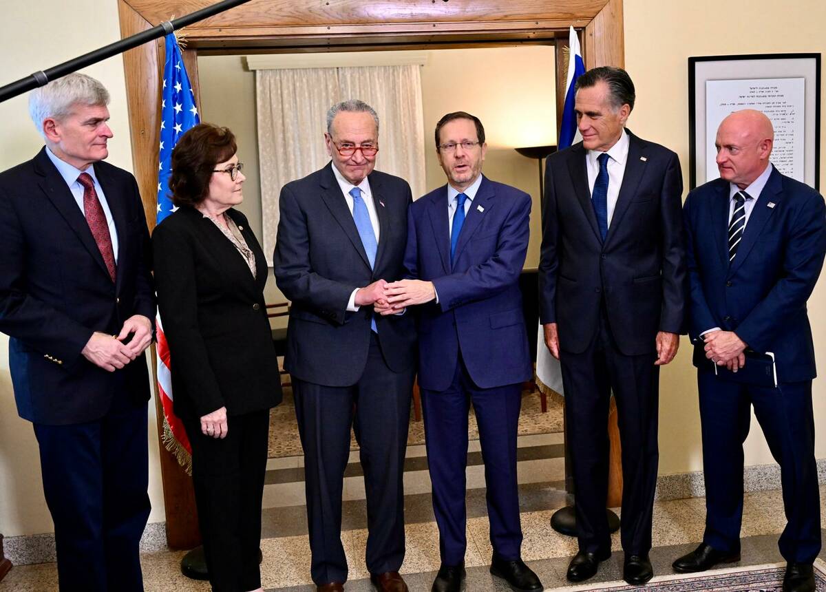 Sen. Jacky Rosen, D-Nev., poses for a photo with her fellow senators and Israeli President Isaa ...