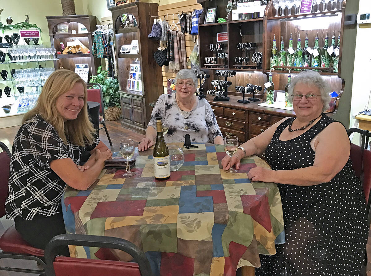Robin Hebrock/Pahrump Valley Times Friends of Willi Baer are seen enjoying a bottle of wine at ...