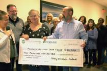 Special to the Pahrump Valley Times The Pahrump Holiday Task Force received a $10,000 check tha ...