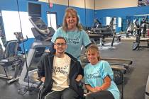 Living Free Health and Fitness founder Shelley Poerio, center, poses with two of Living Free Gy ...