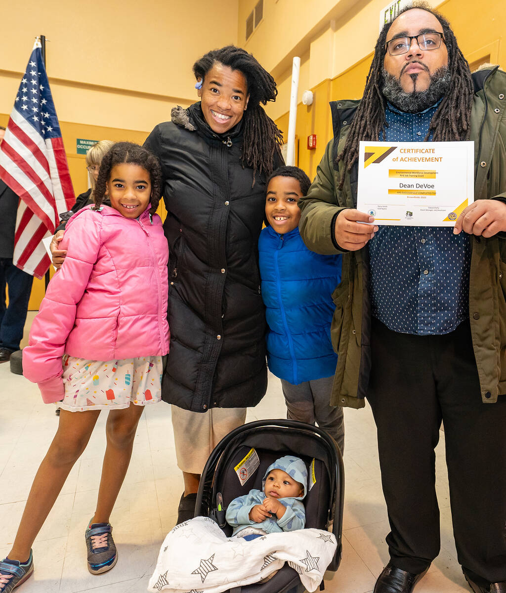 Brownfields Job Training Graduate Dean DeVoe and his family pose for a photograph following the ...