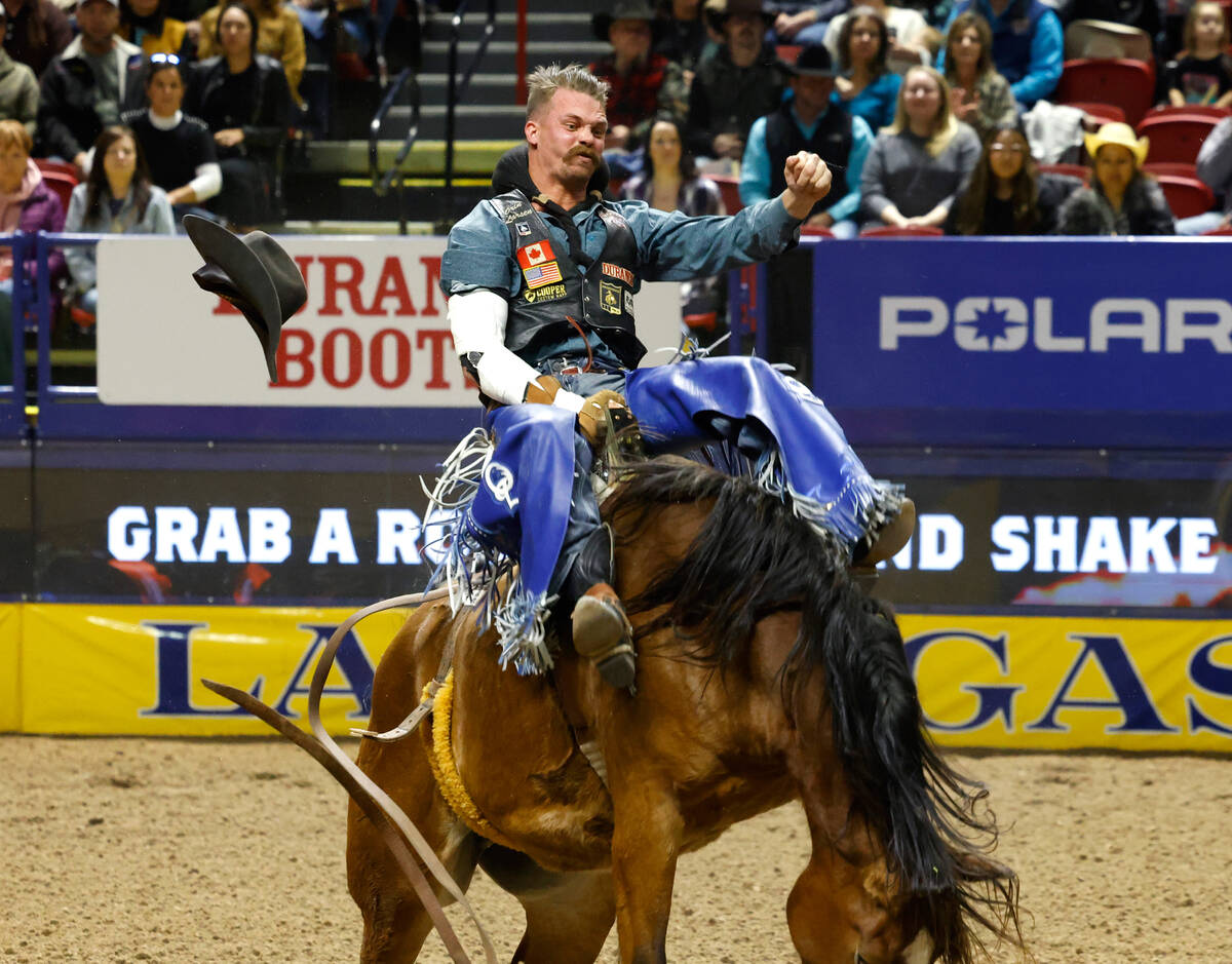 Orin Larsen holds on to his horse while he competes in bareback riding on day six of the Nation ...
