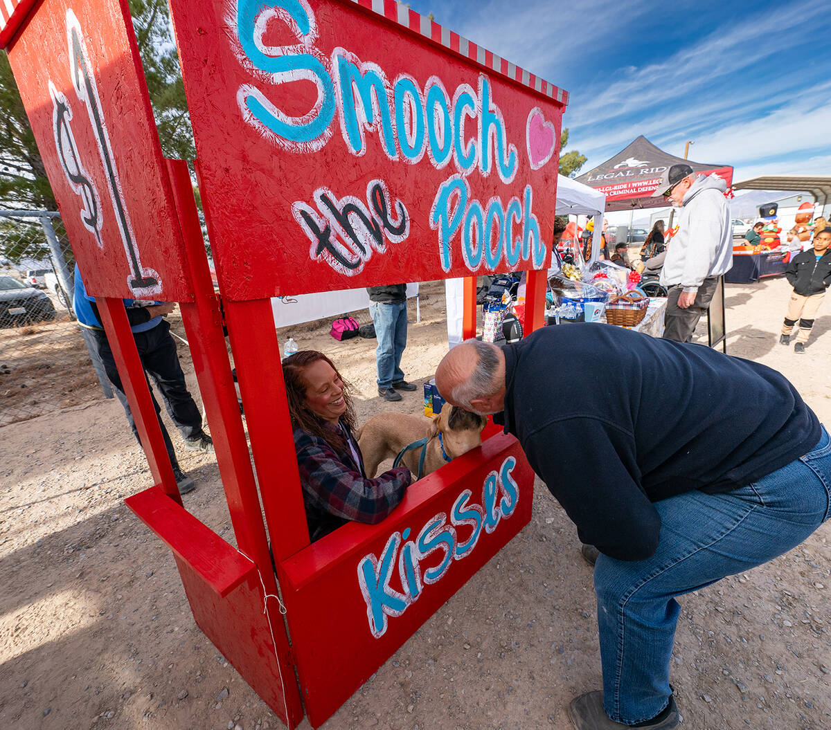 John Clausen/Pahrump Valley Times A "Smooch the Pooch" kissing booth was set up at Winter Wonde ...