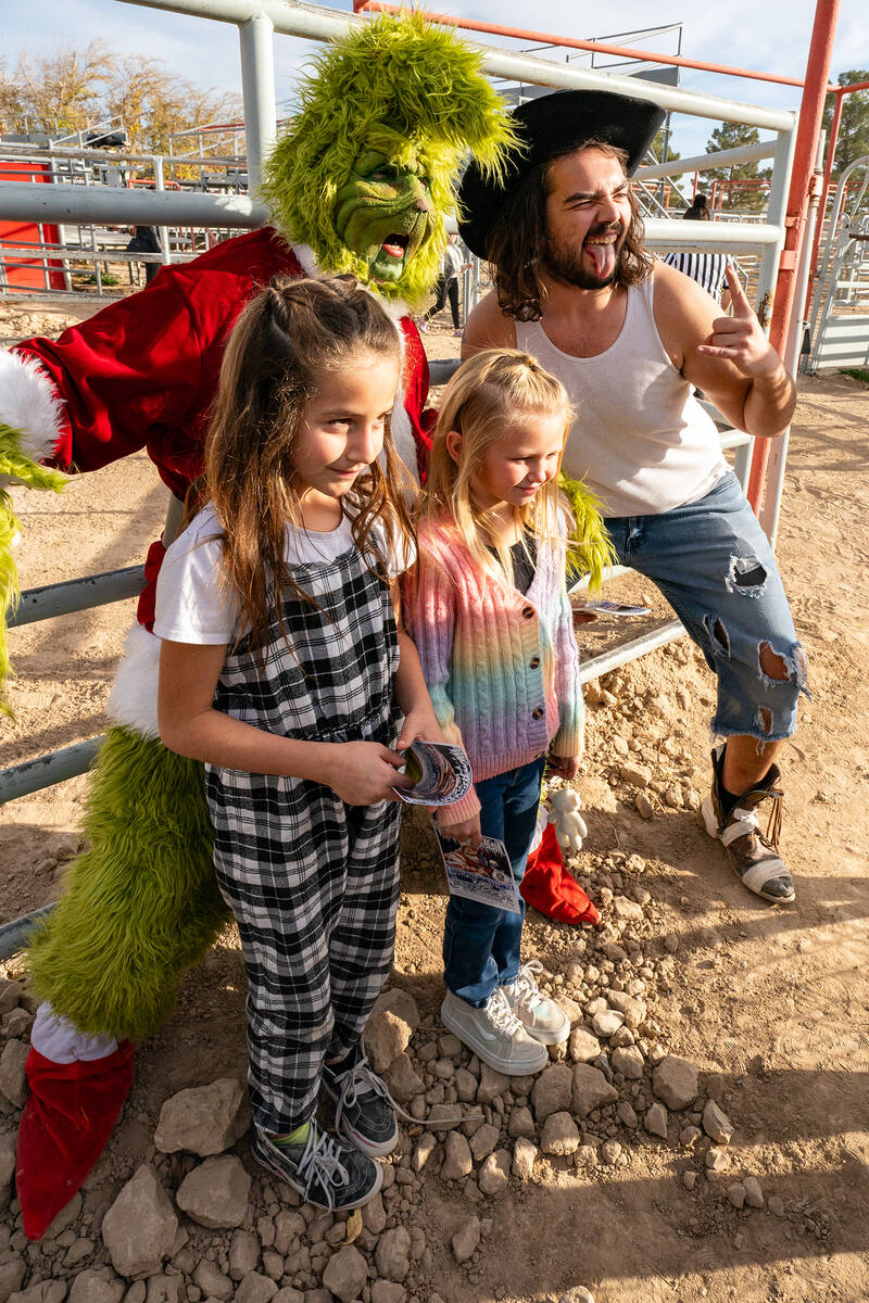 John Clausen/Pahrump Valley Times The Grinch poses with a couple of area children at Winter Won ...