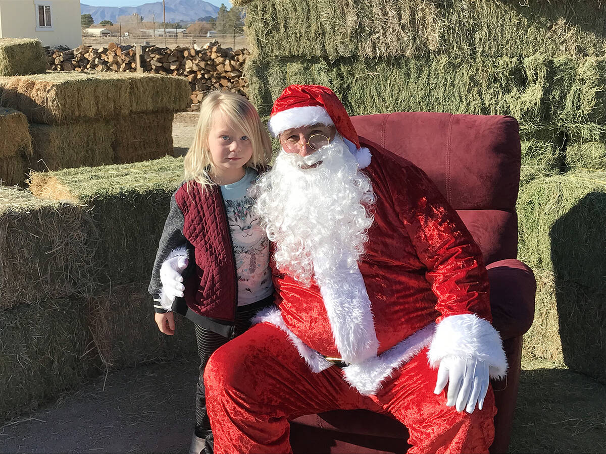 Robin Hebrock/Pahrump Valley Times Santa Claus was at The Avery Project's bike giveaway event o ...