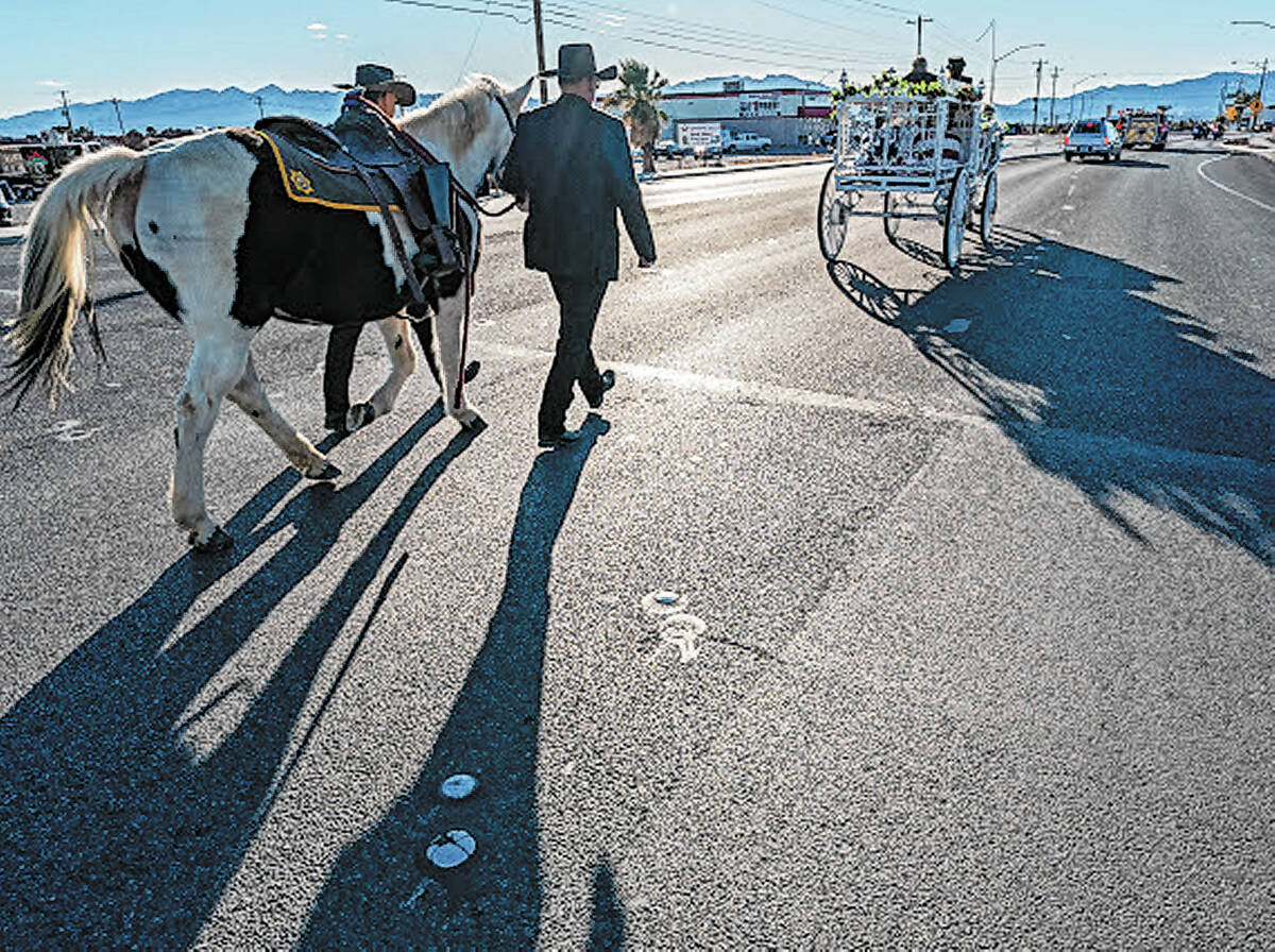 John Clausen/Pahrump Valley Times A horse-drawn carriage carried the casket of Sharon Wehrly al ...