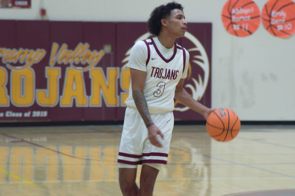 Pahrump Valley Trojans Aleric Cooper (3) dribbling towards the Chaparral Cowboys in Pahrump on ...