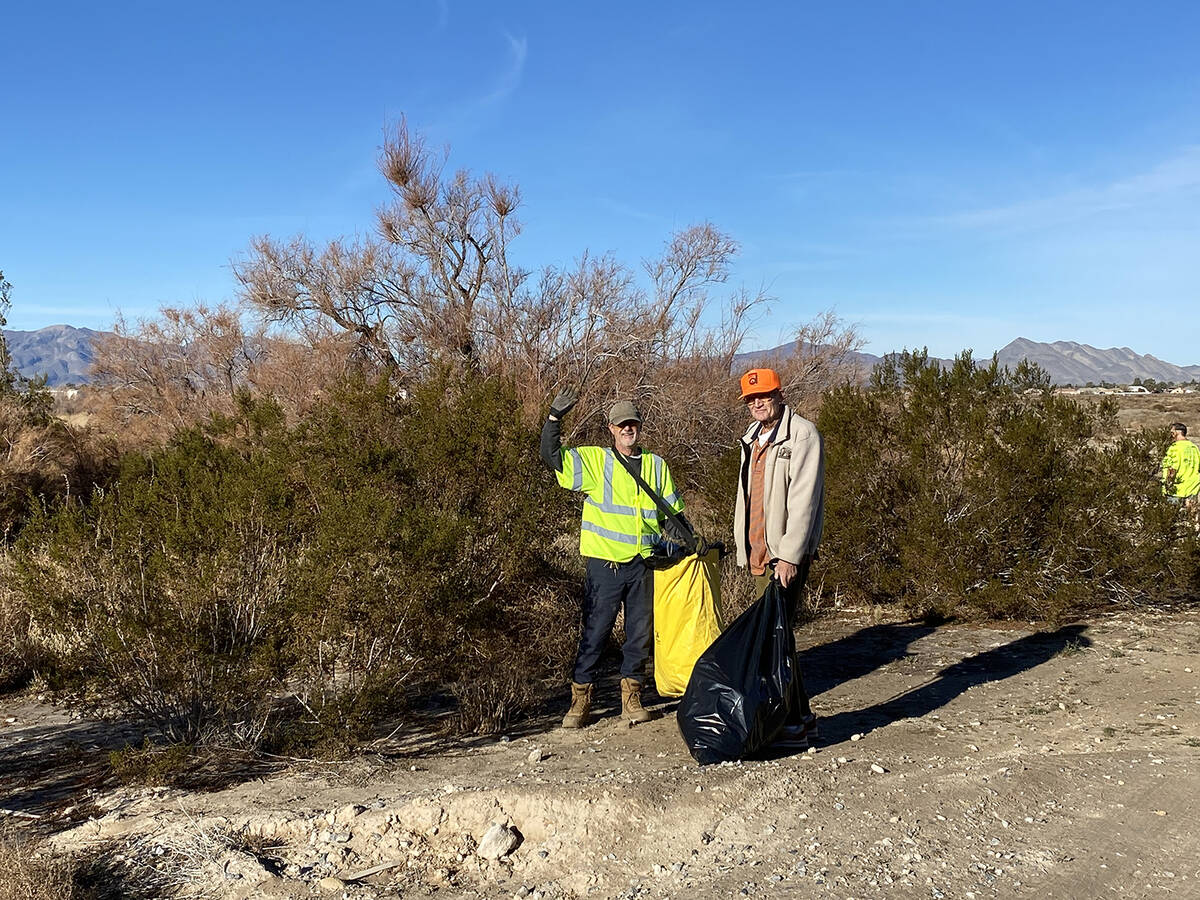 Robin Hebrock/Pahrump Valley Times A duo of Clean Up Pahrump volunteers pause in their trash pi ...