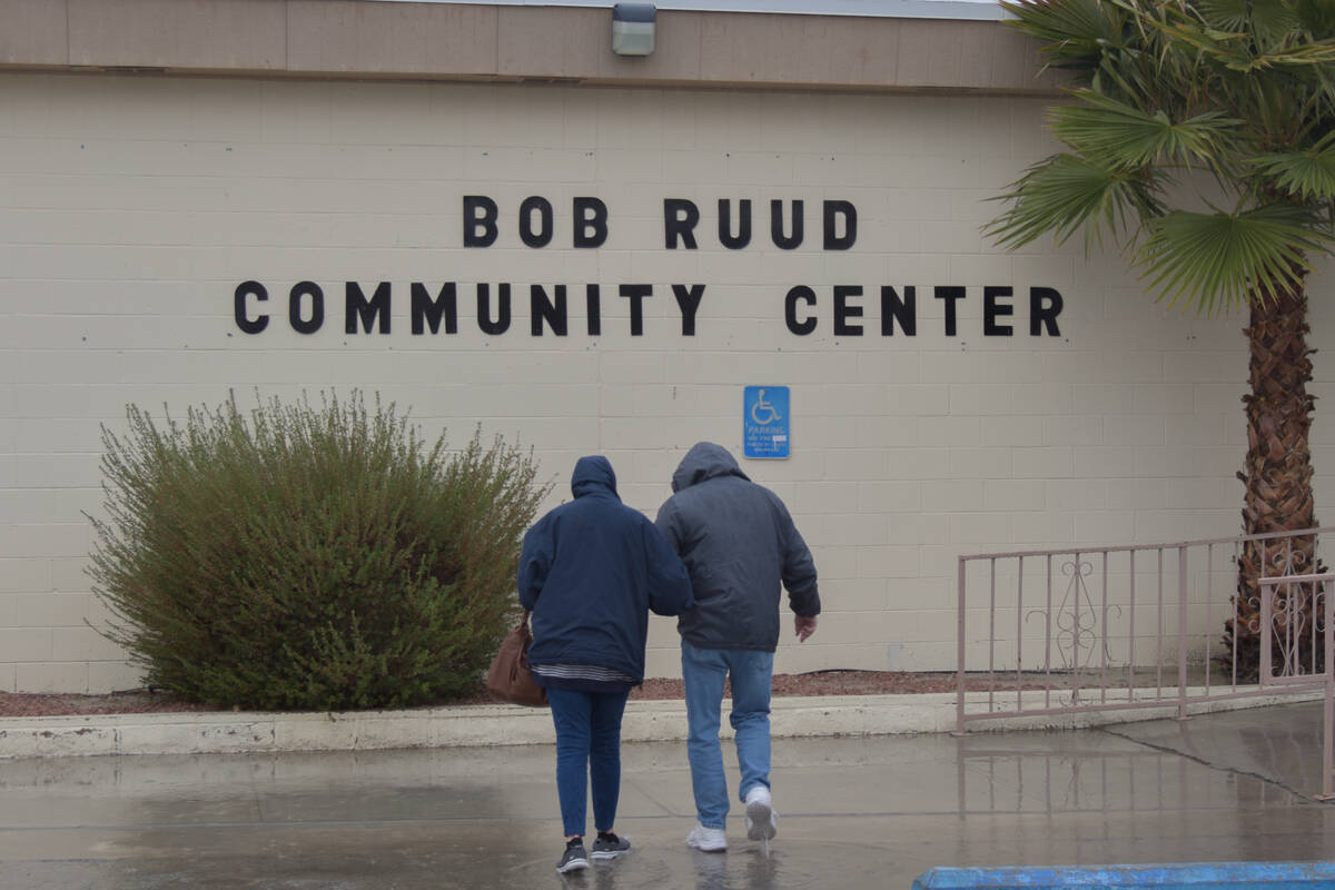 Nye County voters walking in the rain to the Bob Ruud community center for the primary election ...