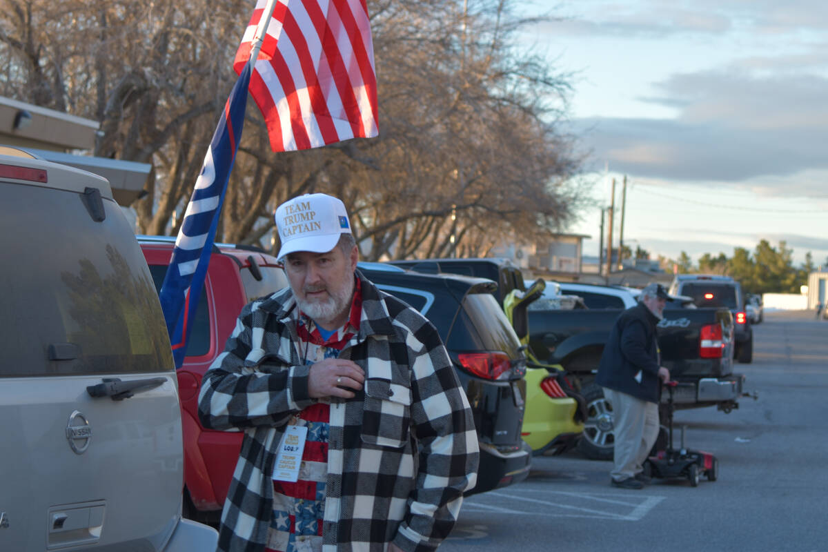 Louis Purdry, a volunteer for the GOP walks in the Bob Ruud Community Center parking lot on Thu ...
