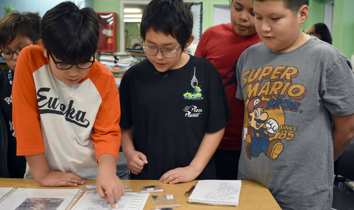 Special to the Pahrump Valley Times Duckwater students examine Native American artifacts. Archa ...