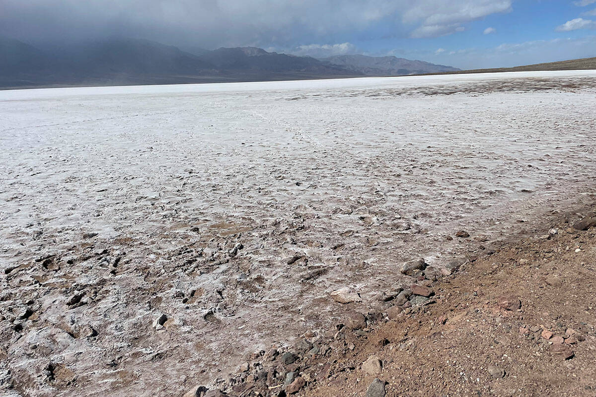 Parts of the dry salt flat at Badwater Basin have re-emerged after being at the bottom of the n ...