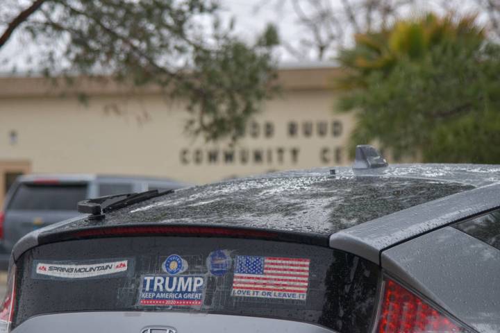 A Honda Insight Hybrid driver parks by the Bob Ruud community center with a political bumper st ...