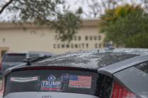 A Honda Insight Hybrid driver parks by the Bob Ruud community center with a political bumper st ...