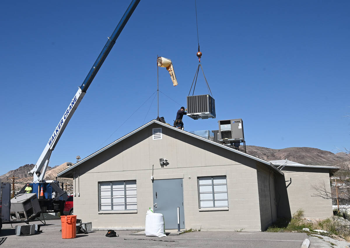Special to the Pahrump Valley Times Workers from Jonaire of Pahrump used a crane to hoist the o ...
