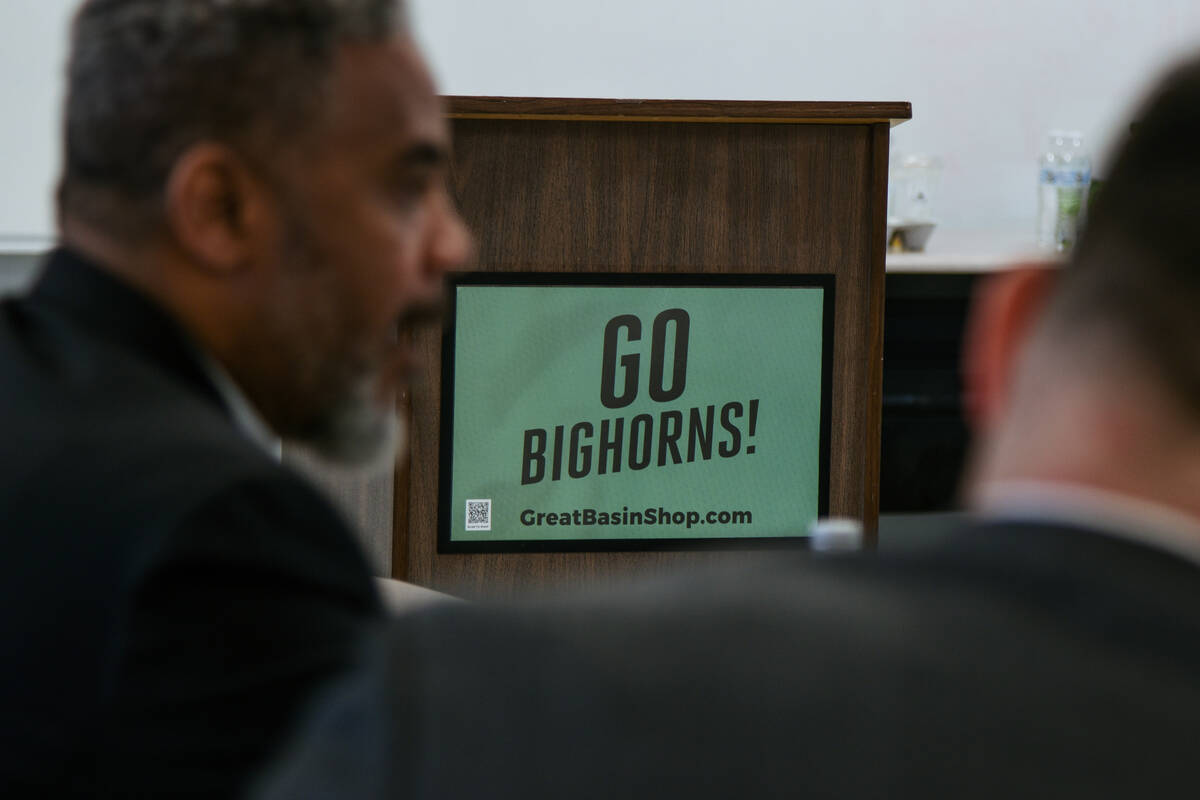 A "Go Bighorns," sign between congressman Steven Horsford (left) and Chris Salute (ri ...