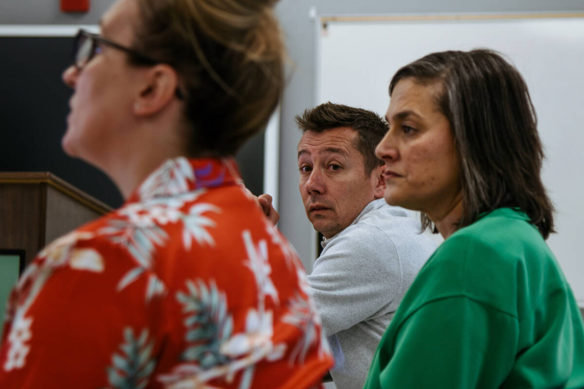 Kenny Weaver (center) waiting to speak about the trends in at the District in a round-table dur ...