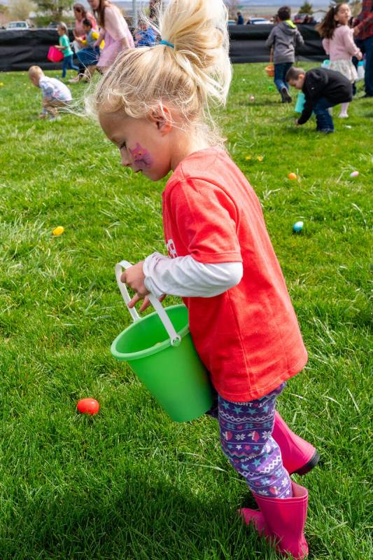 John Clausen/Pahrump Valley Times Arms with buckets and bags, valley children were able to scra ...