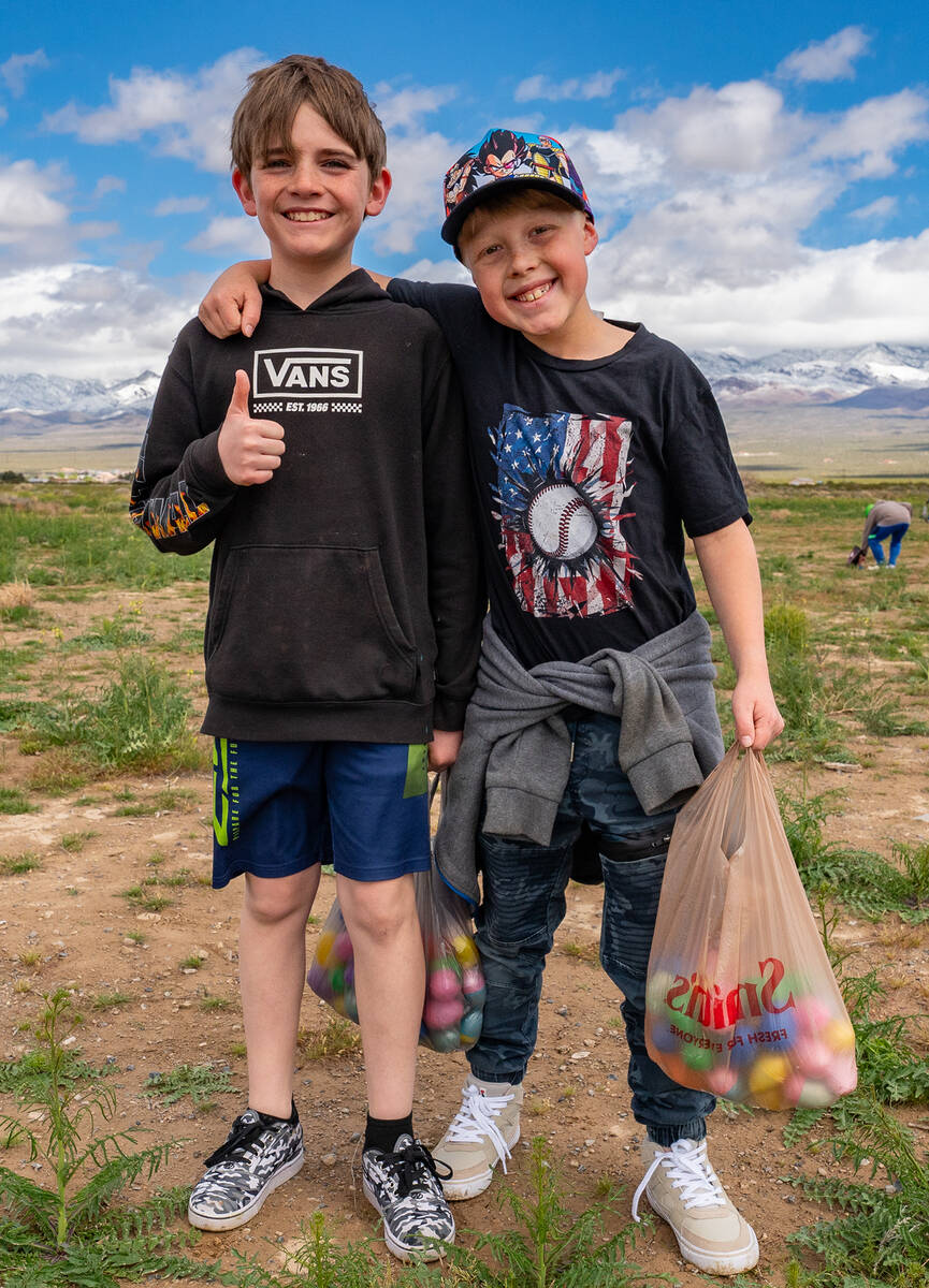 John Clausen/Pahrump Valley Times Two Easter at Simkins Park attendees pause in their Easter Eg ...